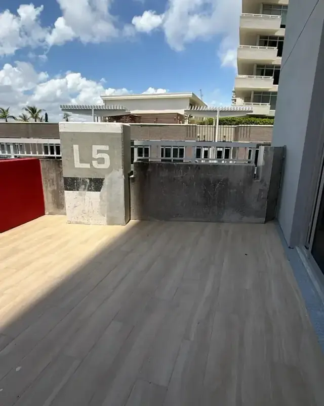 Building deck after pressure washing by Ligio's Solutions in Miami